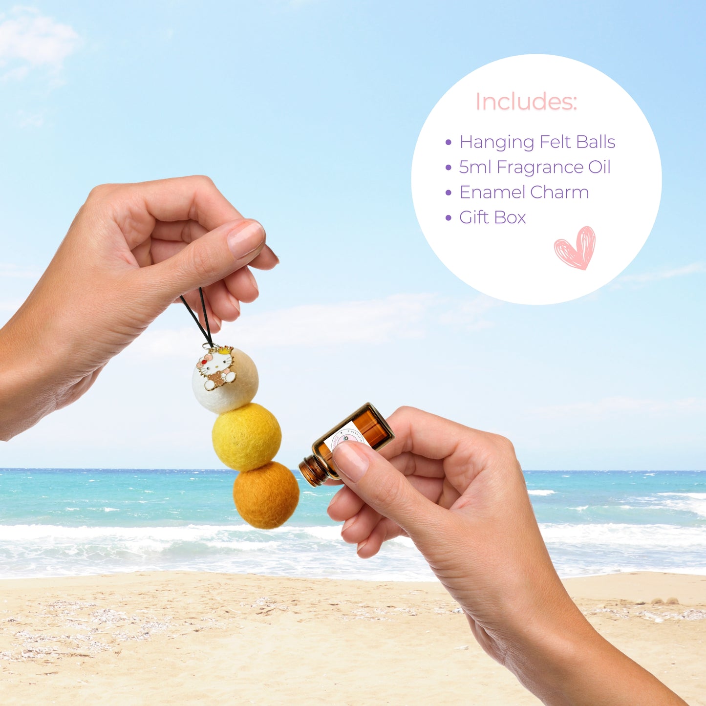 Hands applying cinnamon vanilla oil to reusable felt ball car diffuser with enamel charm