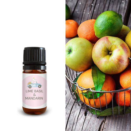 10ml lime basil and mandarin fragrance oil bottle beside fresh apples, oranges, and limes