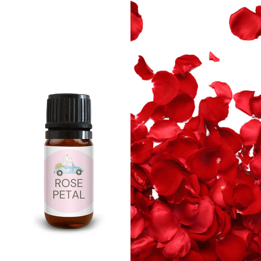10ml rose petal oil bottle beside scattered red rose petals