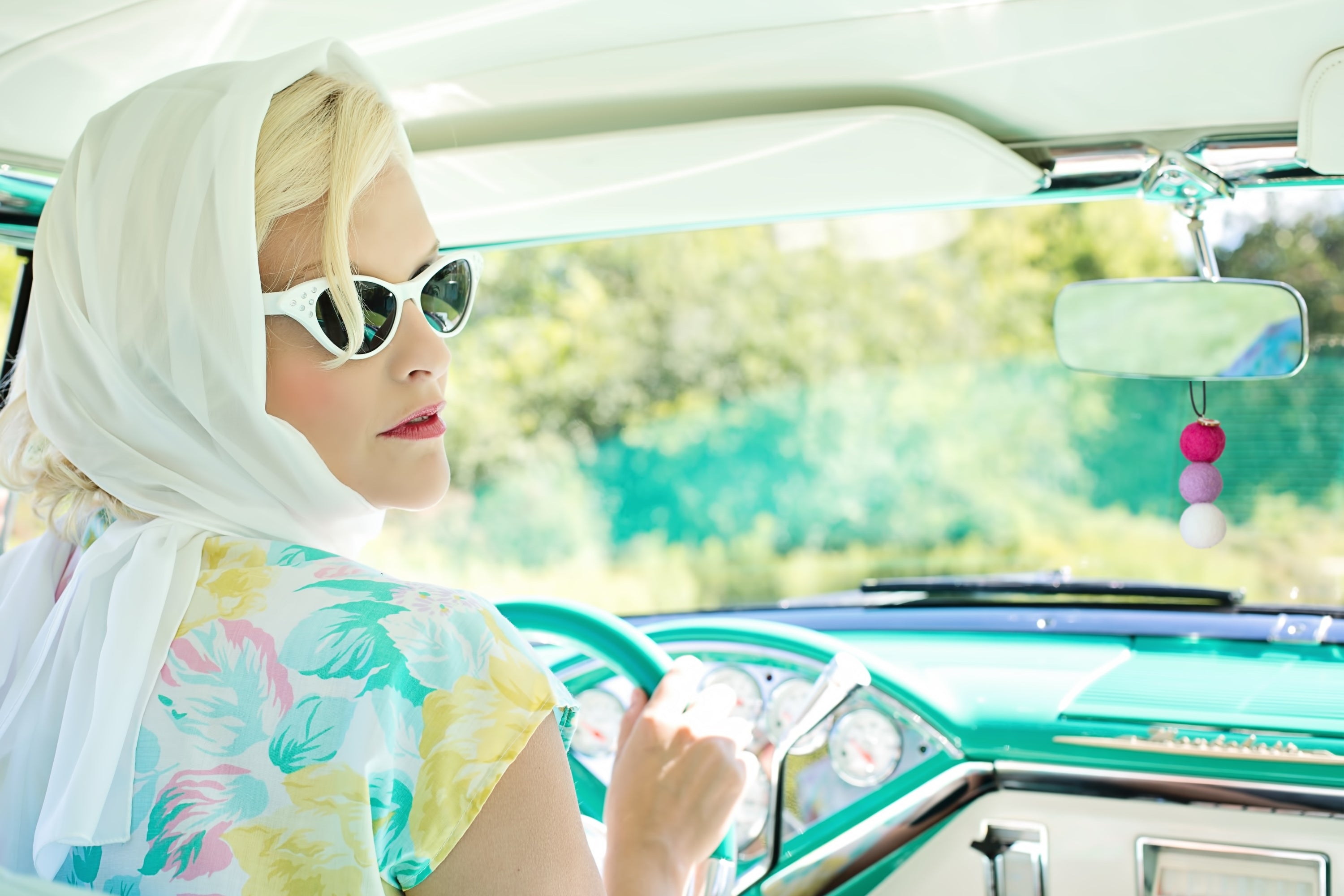Vintage car with lady driving and hanging felt car diffuser